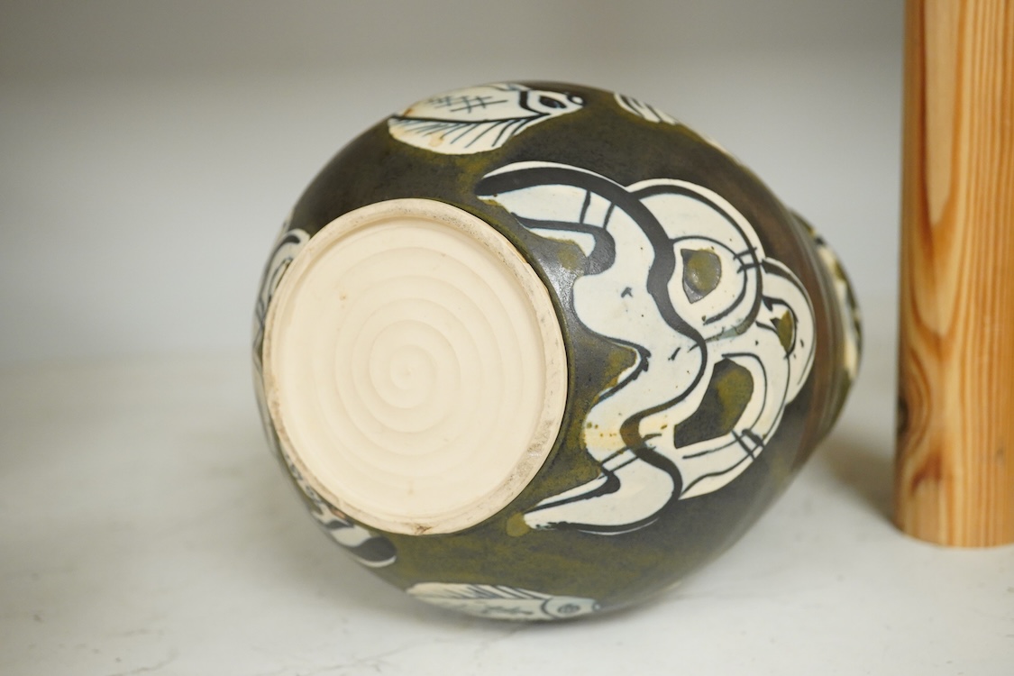 Yolande Beer (Sussex, contemporary), two Studio pottery vessels to include a vase in the form of a basket decorated with fish, largest